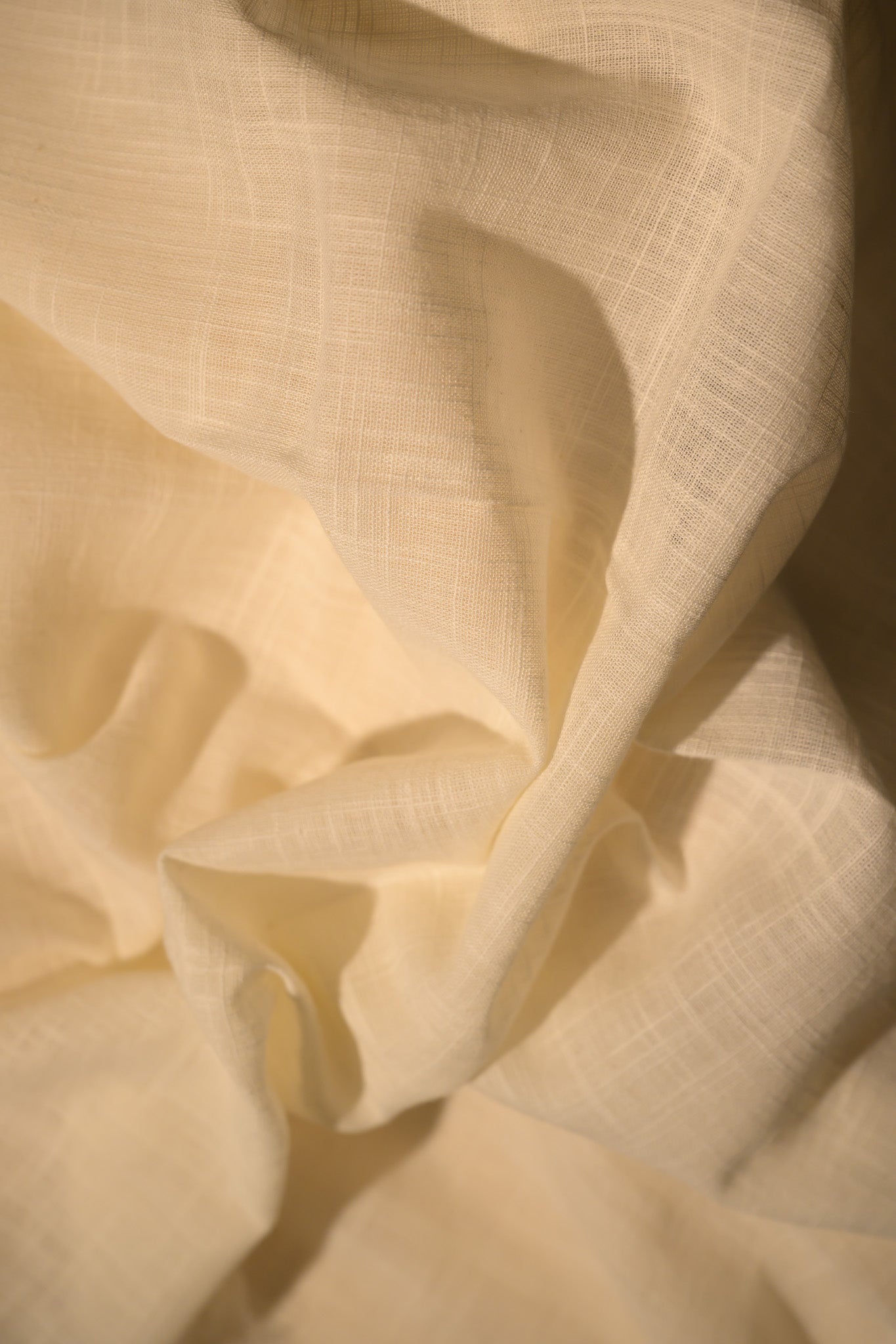 Close-up of beige fabric with a soft texture