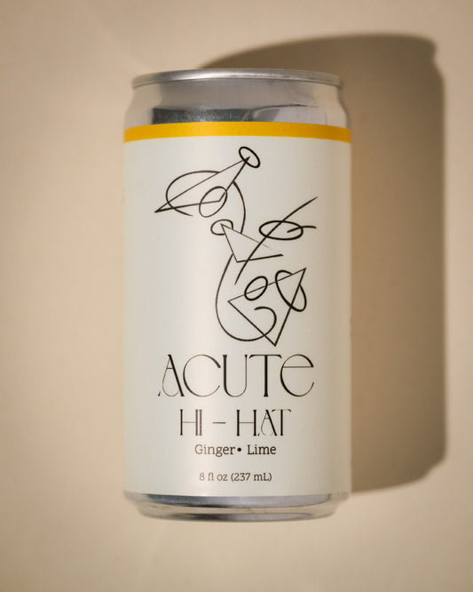 Can of Acute Hi-Hat ginger lime drink on a beige background