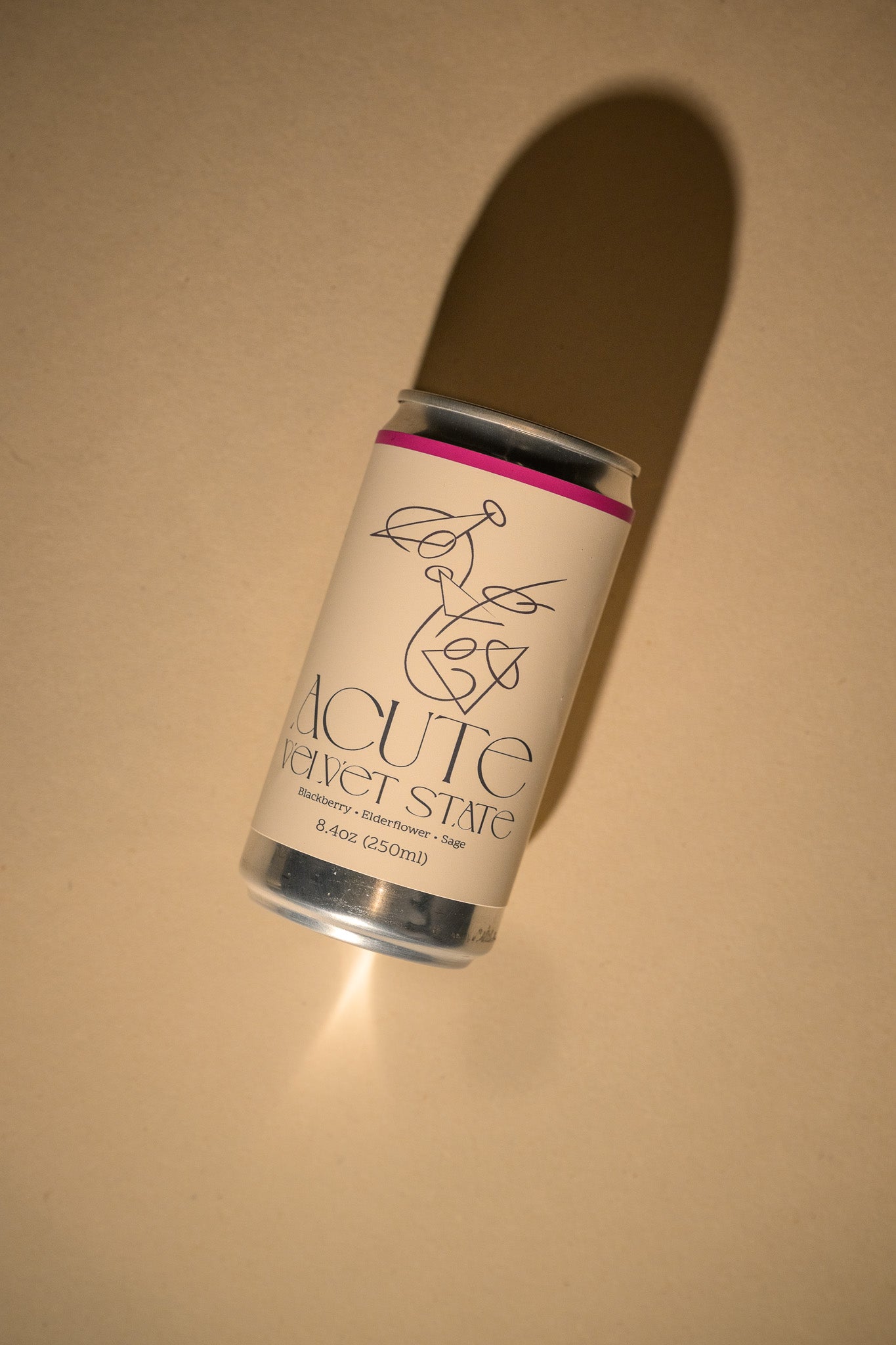 Canister labeled 'Acute Velvet State' on a beige background