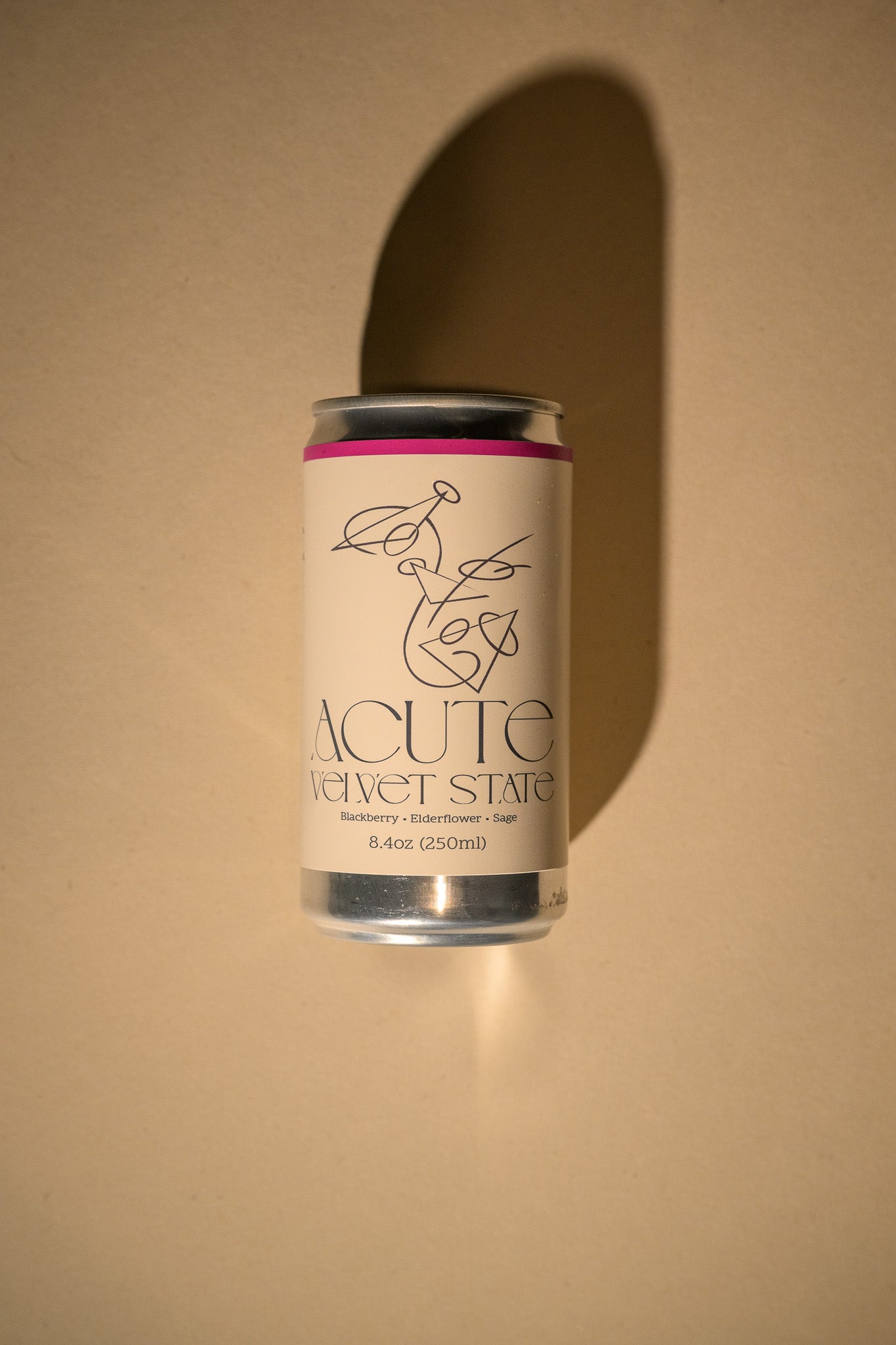 Can of Acute Velvet State on a beige background