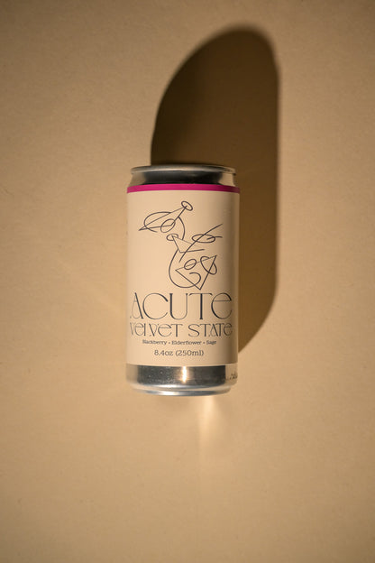 Can of Acute Velvet State on a beige background